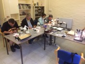 My favoured T-shaped desk arrangement. I can demonstrate on the stem of the T and the trailing extension lead to power the lights can be draped under my feet.